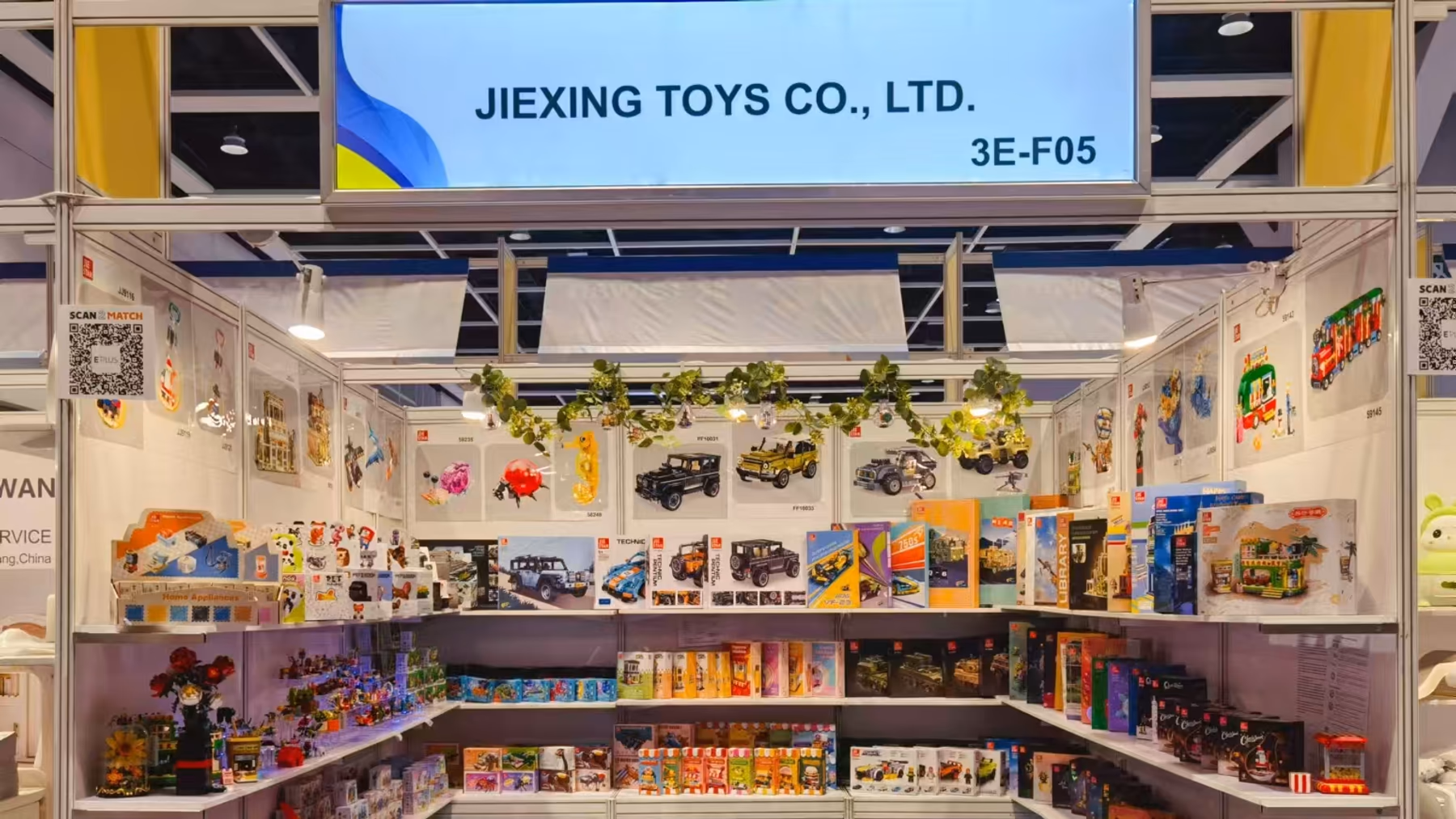 JIESTAR booth 3E-F05 at Hong Kong Toys and Games Fair 2025 with boxed sets and finished models