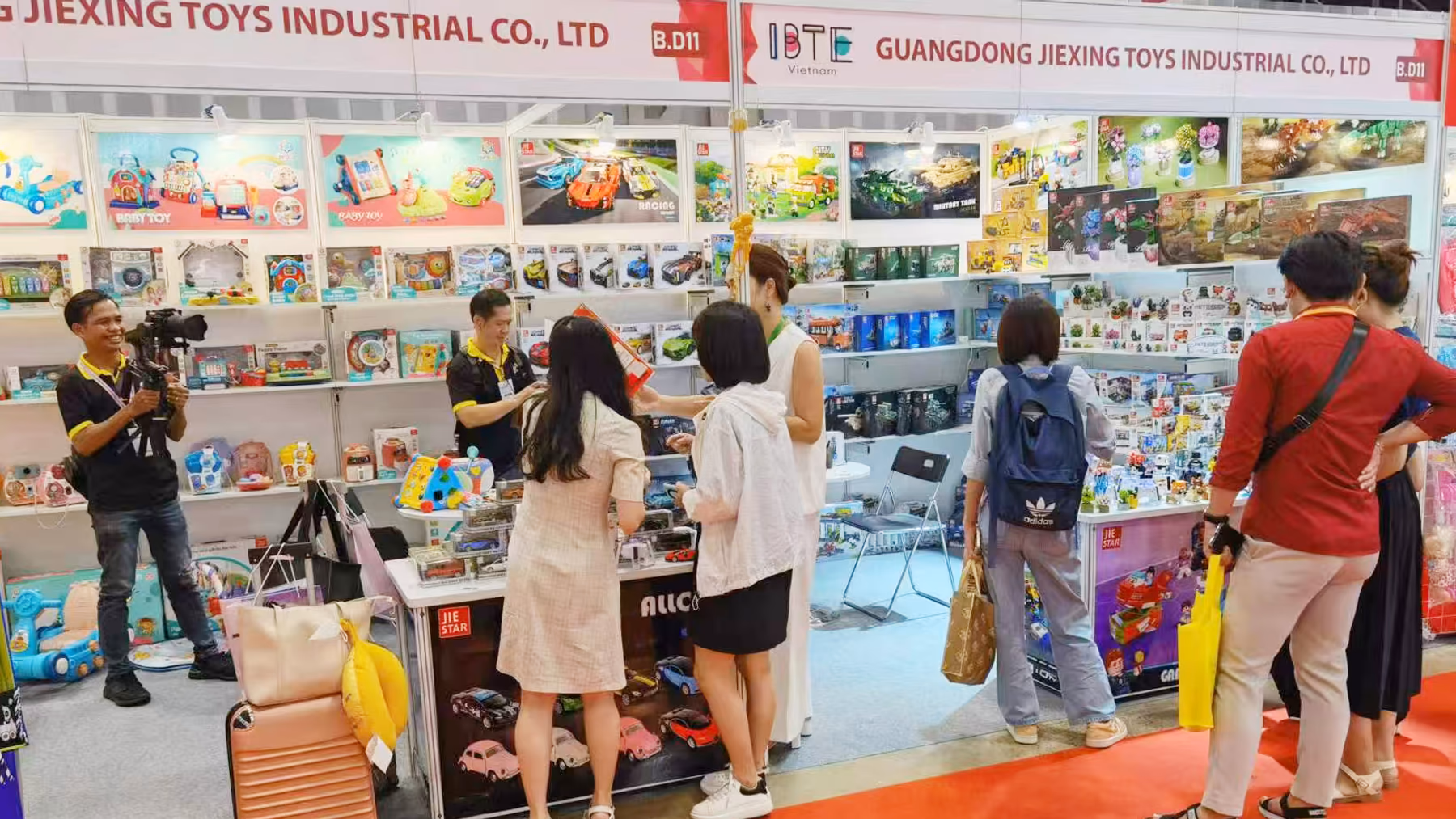 Visitors exploring the JIESTAR product wall at booth B.D11 during IBTE Vietnam 2025